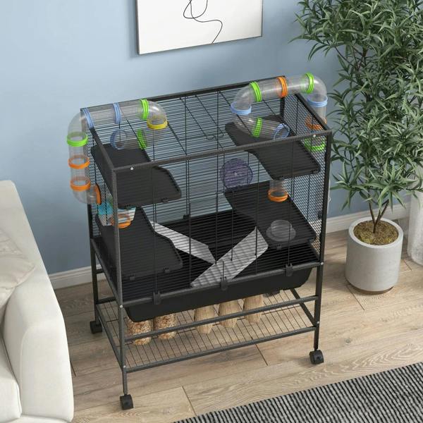Large black hamster cage with wheel, tubes, and platforms in a home setting