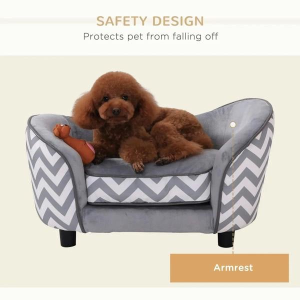 Grey dog couch with chevron sides and safety bolsters; small dog lying down