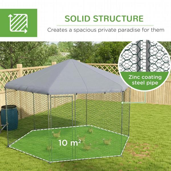 Chicken run with grey fabric roof and chain-link mesh walls in a garden yard