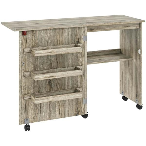 Grey folding sewing table with drop-down leaf, open shelves and caster wheels