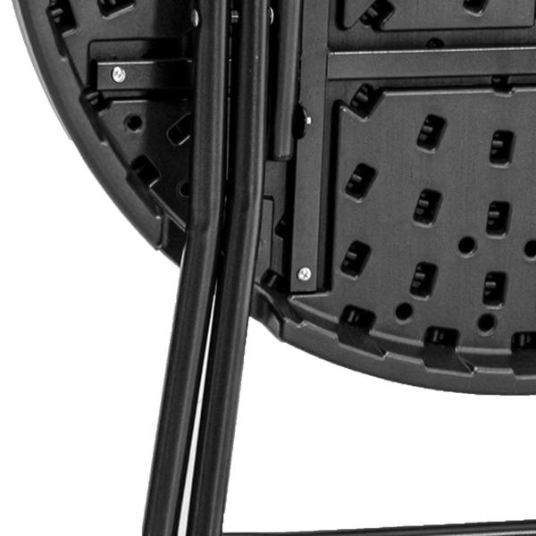 Close-up of folding steel frame locking plate on a round dark grey table