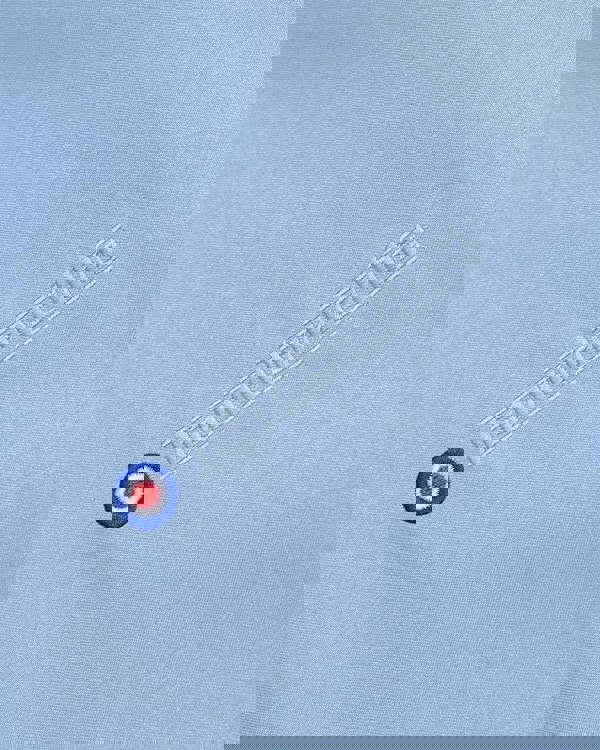 Lambretta Mens Showerproof Classic Harrington MOD Scooter Jacket Coat, close-up of light blue water-resistant fabric with Lambretta logo and MOD roundel emblem embroidered on the sleeve.