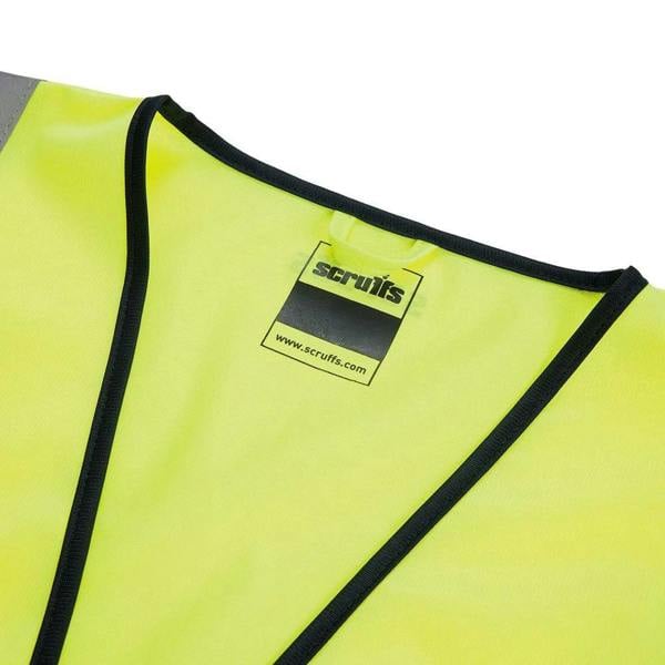 Scruffs High Visibility Men's Hi-Viz Technical Zip Up Vest, close-up of the bright yellow high visibility safety vest with black trim and label.
