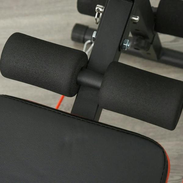 Black padded thigh support rollers on adjustable sit-up bench frame