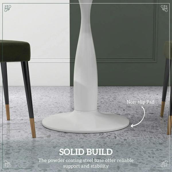 White pedestal dining table with wide base and visible non-slip foot pad