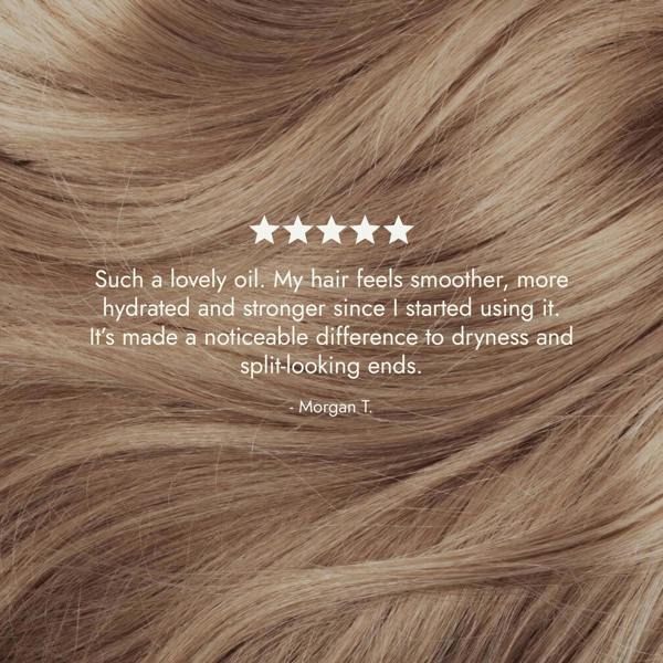 Rosemary hair oil bottle with dropper on a stone surface with natural light. Rosemary hair oil, argan, almond, bond, boost, hair growth, coconut oil, healthier, fuller-looking hair, stimulate, regrowth, hair thinning, natural, 100ml, review, 5 star