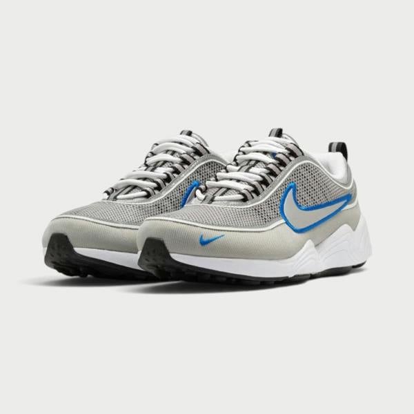 Supplied Fashion Air Zoom Spiridon SP sneakers in metallic silver and grey mesh with blue swoosh accents