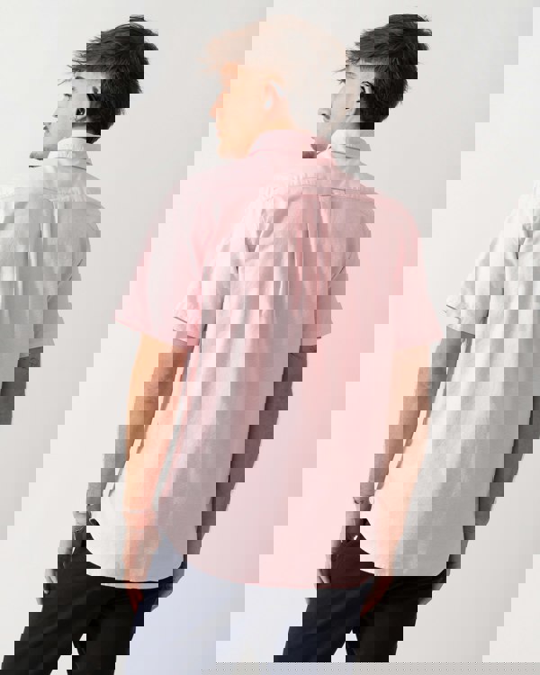 back shot of a Model wearing a GANT Mens Regular Fit Short Sleeve Oxford Shirt in Washed Pink