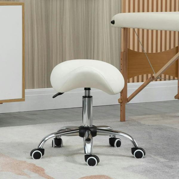 Cream faux leather saddle stool with chrome base, swivel, and caster wheels