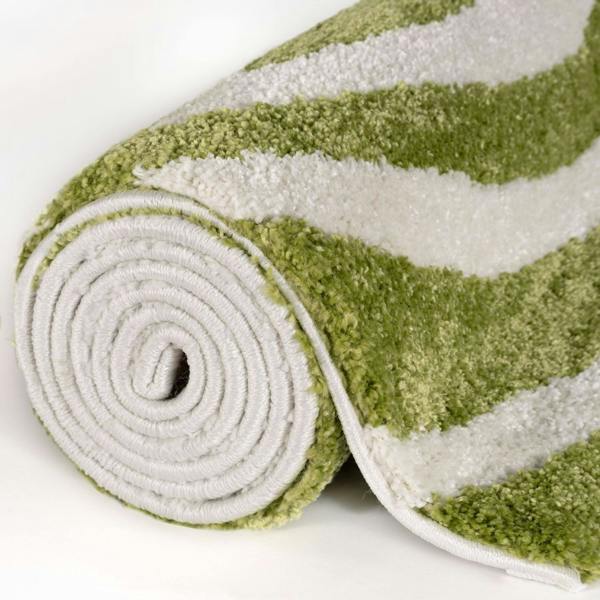 Rolled-up green and white striped rug on a white background