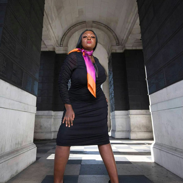 Silk scarf with Orange Bird of Paradise and Pink and Purple print, styled elegantly around model's neck over a Black Plus Size Bodycon Dress.