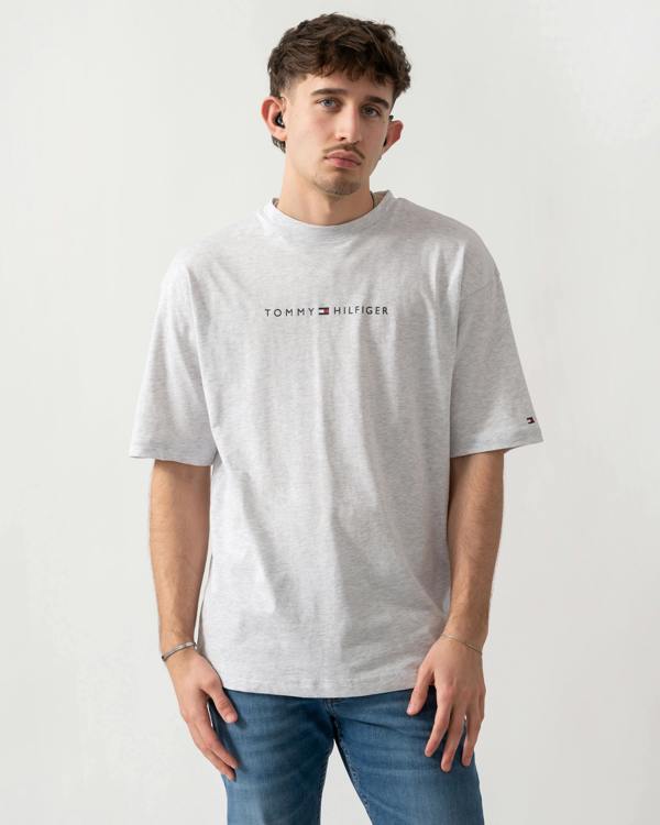 model wearing a Tommy Hilfiger Logo Mens Lounge Tee in Ice Grey Heather