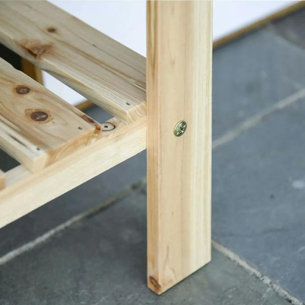 Natural wooden raised plant stand with metal corner brackets and slatted inner shelf