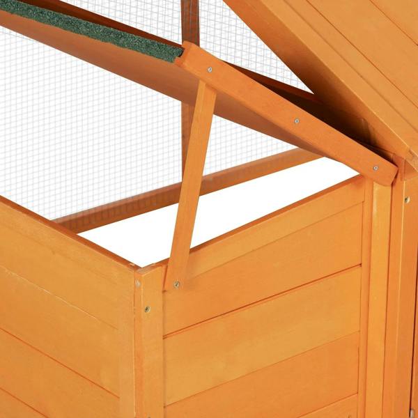 Orange wooden chicken coop frame with wire-mesh roof support and side panel.
