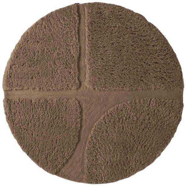 Round brown bath mat with textured surface on a white background