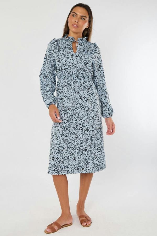 Woman wearing a floral dress on a white background