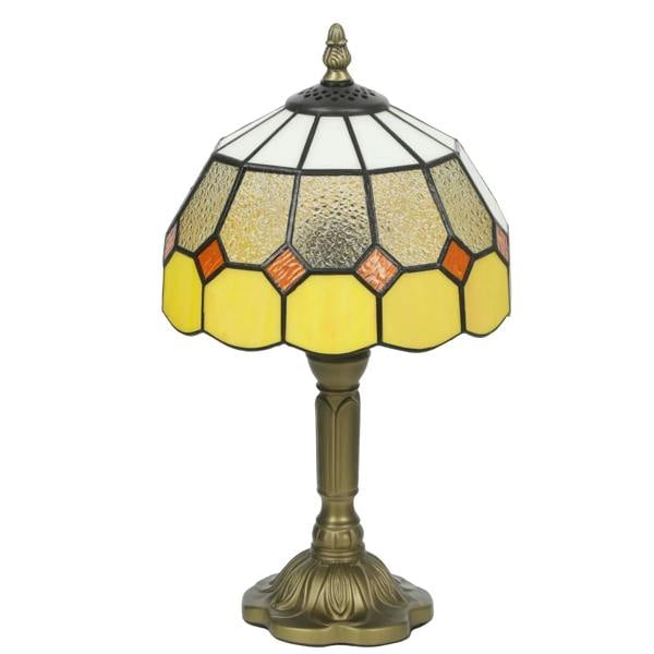 Yellow-orange stained glass table lamp with hexagon shade and brass base
