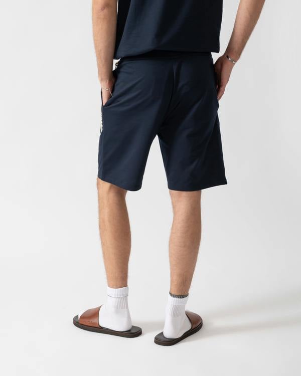 back of a model wearing a BOSS Orange Authentic Mens Loungewear Shorts with Stripe and Logo in Dark Blue 405