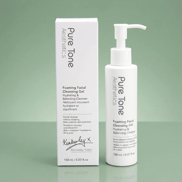 Pure Tone Aesthetics Foaming Facial Cleansing Gel bottle and gift box on a reflective soft green surface
