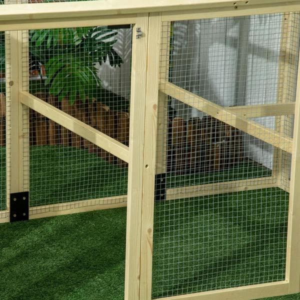Close-up of wooden chicken run frame with wire mesh panels and interior crossbar