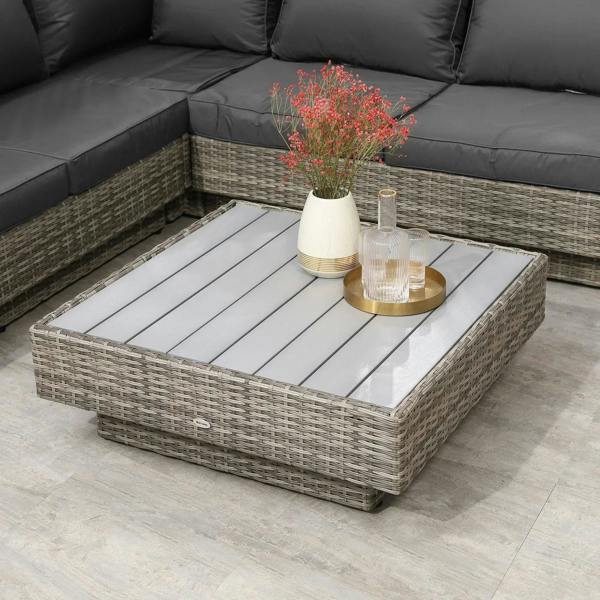 Square wicker coffee table with slatted glass top, styled with drinks