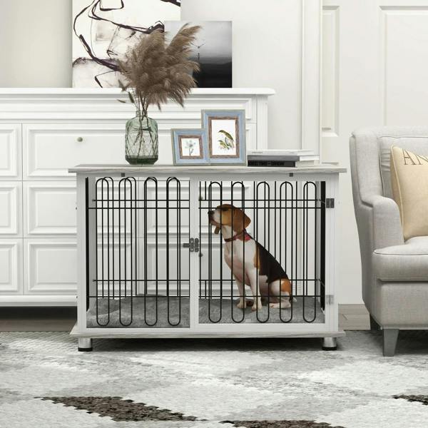 Indoor dog crate end table with grey cushion and black wire doors, housing a seated dog