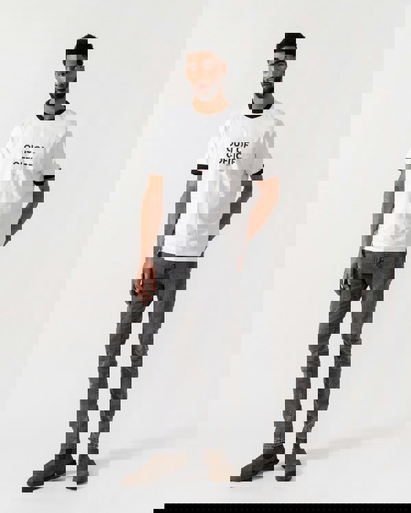 Model wearing HUGO Out-Of-Office T-Shirt in White 100 - full length