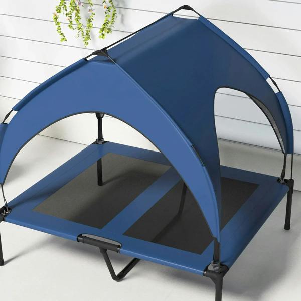 Dark blue elevated dog bed with arched canopy and breathable mesh platform, angled view