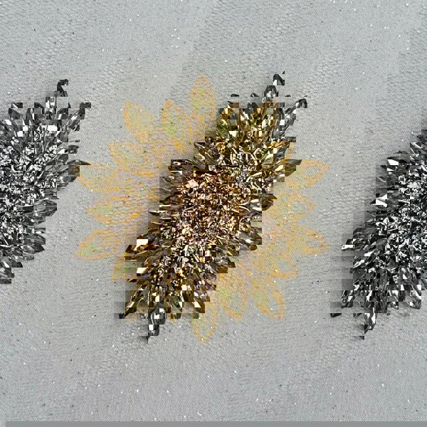 large flower brooch, gold tone, front view, detailed petal design, statement floral pin, elegant accessory for coats, dresses or scarves
