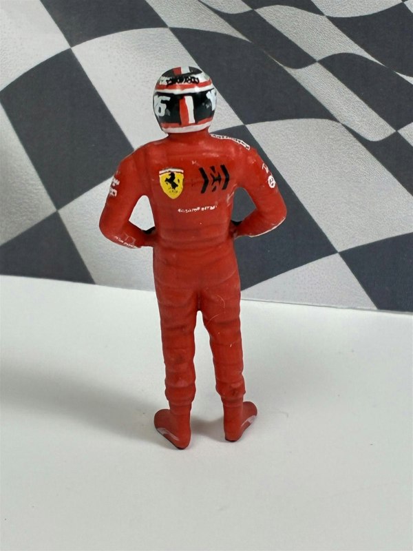 a toy figure of a man wearing a helmet