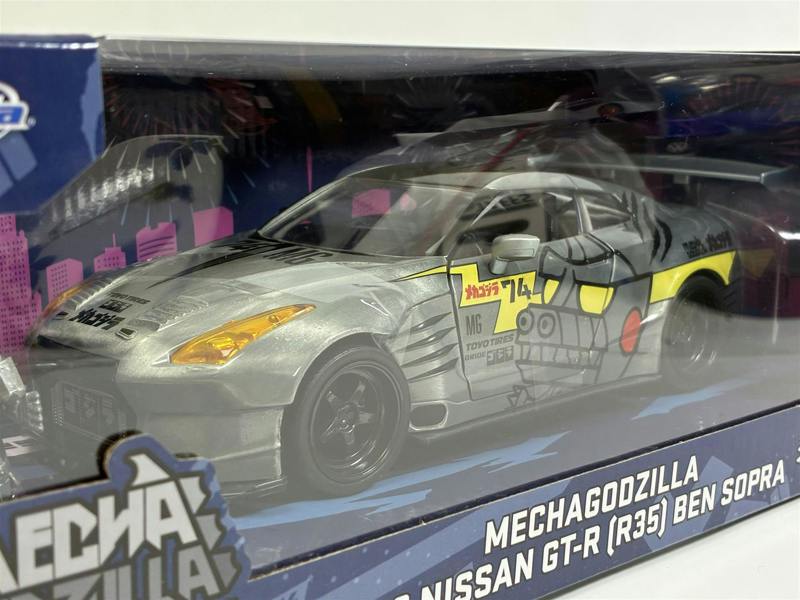 MCSlots Mechagodzilla Figure and 2009 Nissan GT-R R35 Ben Sopra 1:24 Scale Jada 36285