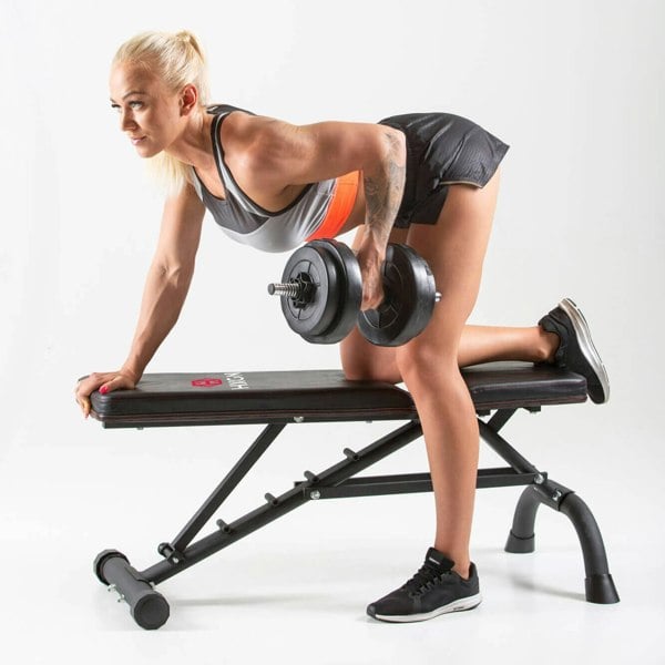 Woman performing dumbbell one arm rows on a HXGN Ultimate Weight Bench