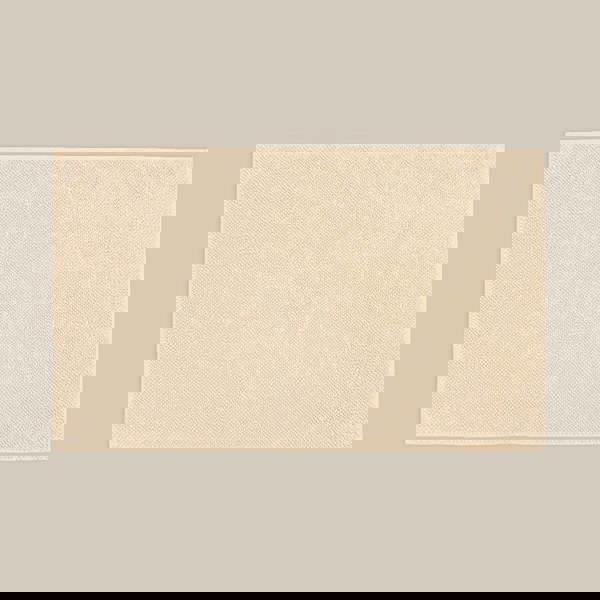 Neutral beige bath mat made from organic cotton. Soft and sustainable bathroom accessories.