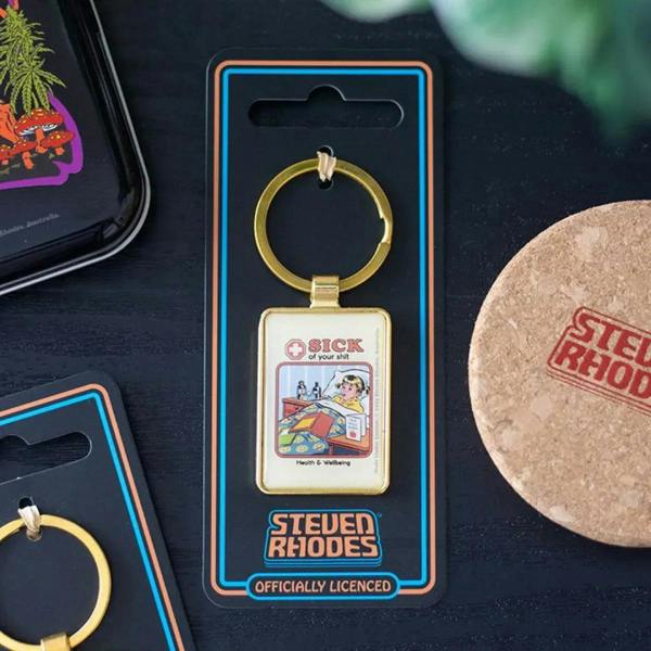 Steven Rhodes keyring in retail blister with gold hoop and square “SICK of your shit” charm