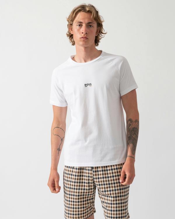 model wearing a BOSS Orange Mens Slim Fit Beach T-Shirt in Natural 105