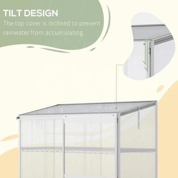 Silver greenhouse cold frame with slanted roof and transparent polycarbonate panels