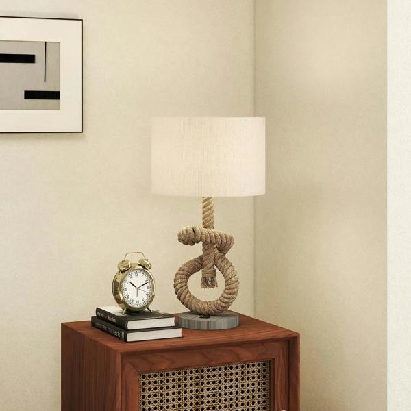 Hemp rope table lamp with cream shade on a wooden nightstand