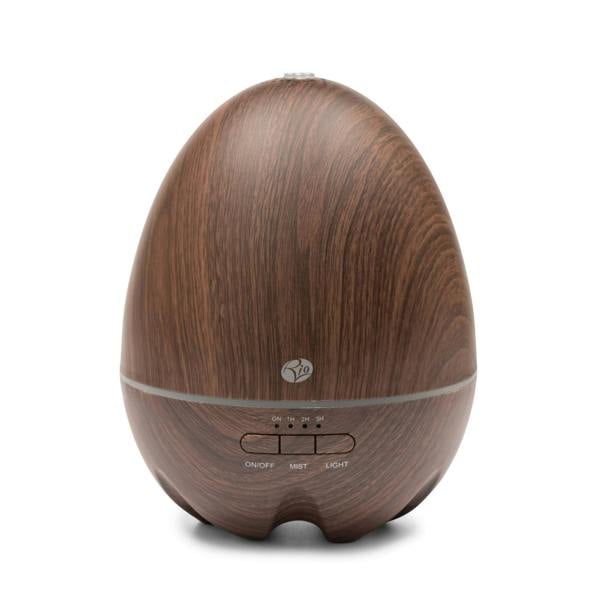 The Rio ARIA Aroma Diffuser Humidifier and Nightlight features a dark wood-grain, egg-shaped design with easy-access front buttons for on/off, mist, and light—perfect for relaxation and décor.