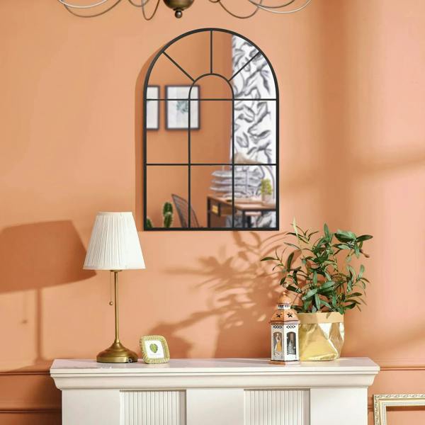Arched grid mirror with black frame and window-style grid pattern across the glass.