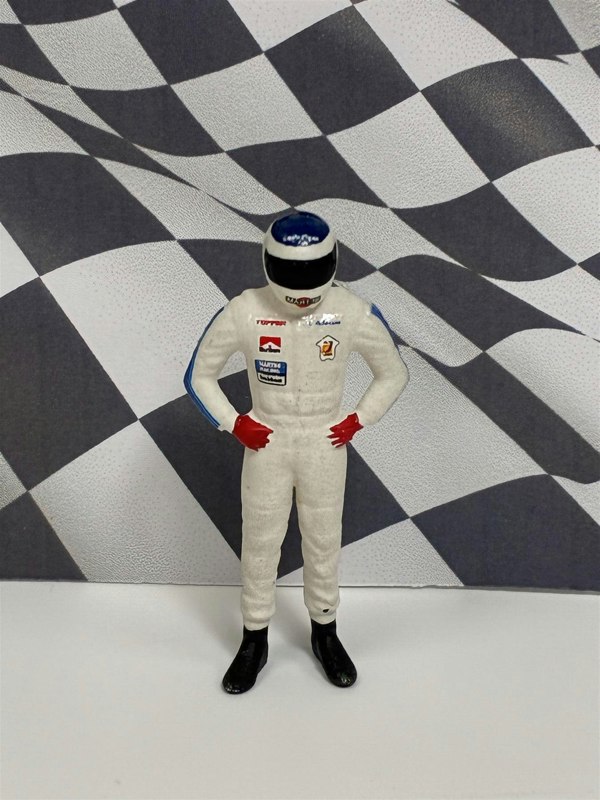a toy figure of a race car driver