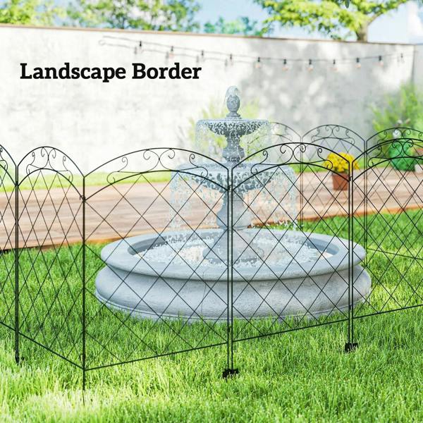 Black decorative fence panels outlining a garden border with arched swirls and diamond mesh