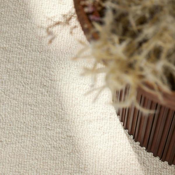 Fine Boucle Wool Rug Knots Natural White sound-absorbing, durable pile.