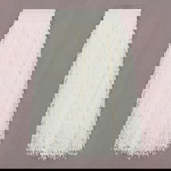 White lace skirt on a grey background