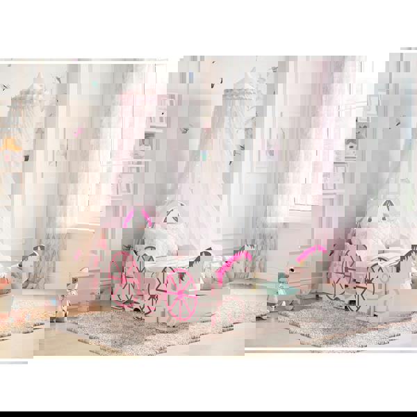 Horse and carriage themed bed frame in a modernly decorated bedroom.