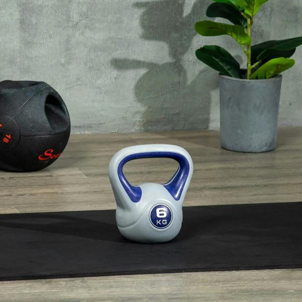 6 kg kettlebell with purple handle and grey body, standing on floor mat