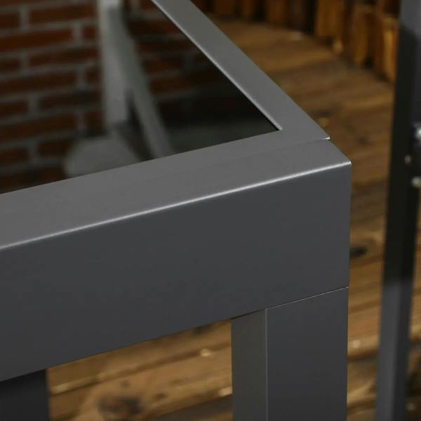 Close-up of the dark aluminium table base and edge of the extending tabletop