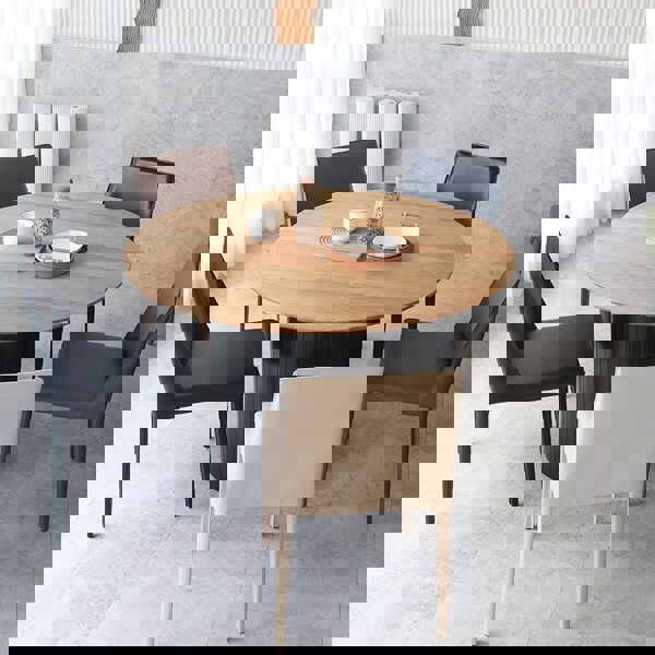 Barbican Round Dining Table in a lifestyle setting with round extending dining table