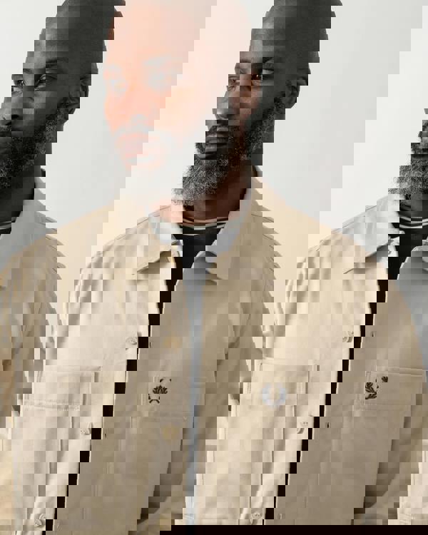 close up shot of a Model wearing a Fred Perry Mens Twill Overshirt in Oatmeal