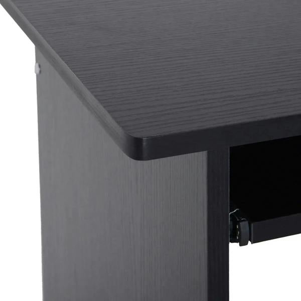 Black desk side panel and open shelf corner with metal knob detail