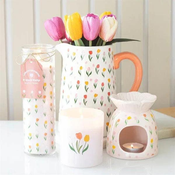 Tulip-print wax warmer set with one lit ceramic burner and two unlit pieces